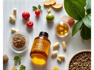 Assortment of natural supplements and vitamins in eco-friendly packaging, on a clean, health-focused background.